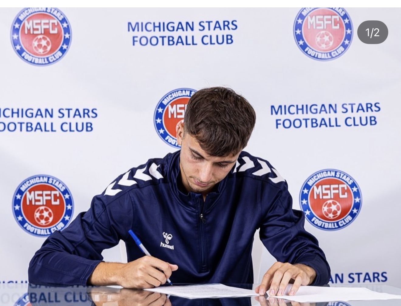 Signing a professional contract with Michigan Stars FC
