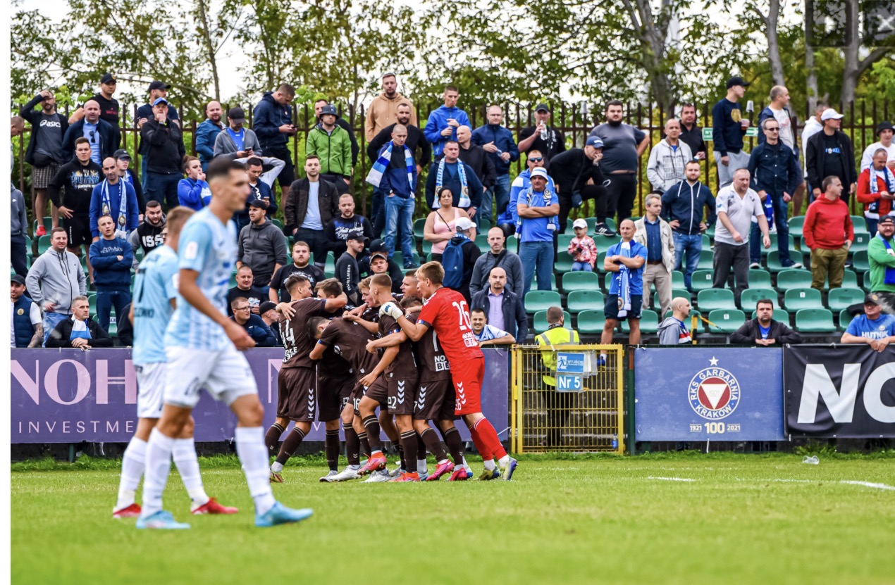 Thomas Pranica and teammates celebrating a goal in front of the home crowd